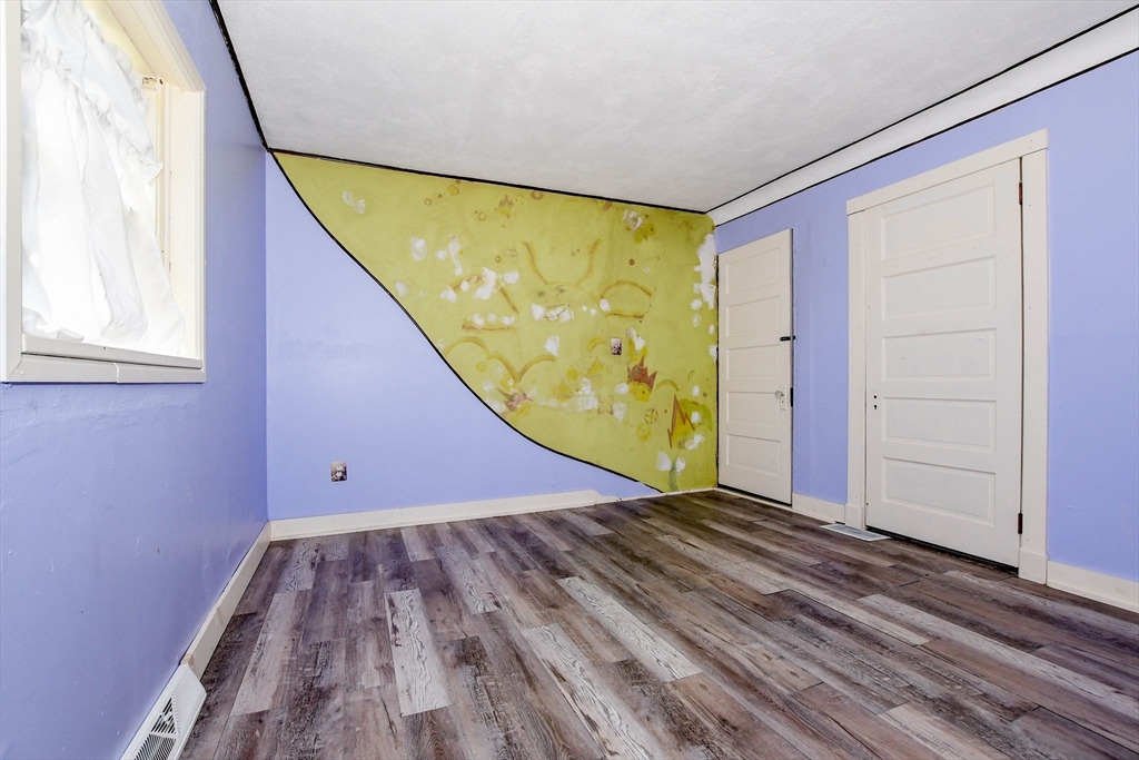 6 Gilbert Way Wareham, MA 02571 - Photo 29 of 41 a view of an empty room with wooden floor and a window