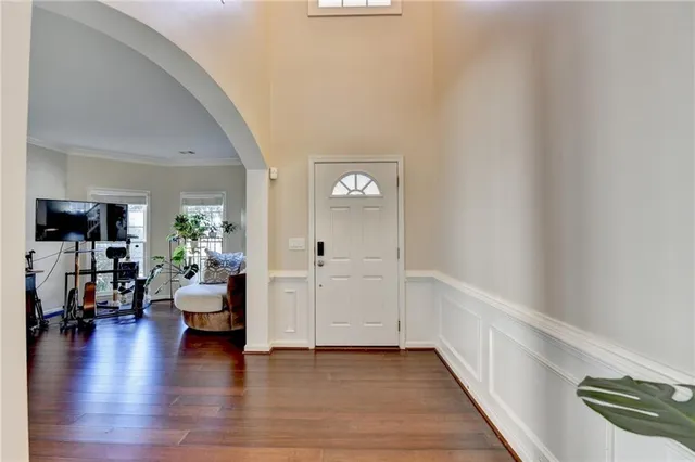 a view of a livingroom with furniture and hardwood floor