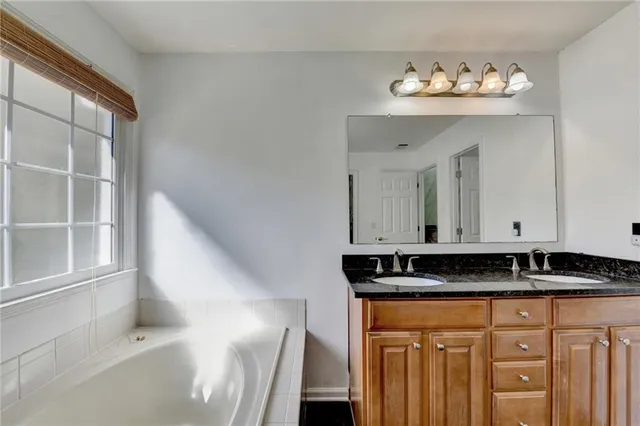 a view of a kitchen with granite countertop cabinets and a sink