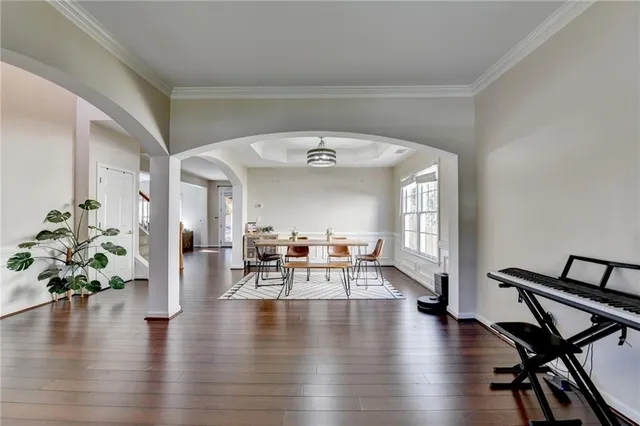 a view of a livingroom with furniture and a floor to ceiling window