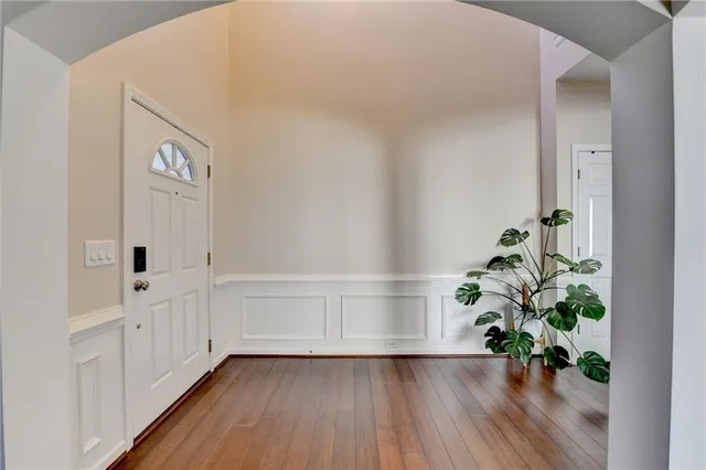 a view of an entryway with wooden floor