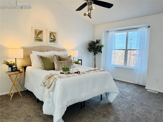 a bedroom with a bed and a cabinets