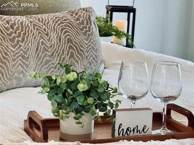 a bed room with a bed and a chandelier