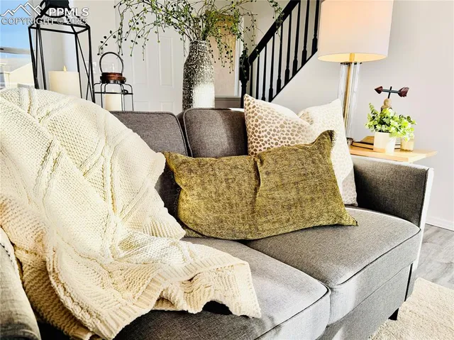a kitchen with a table potted plant and a window