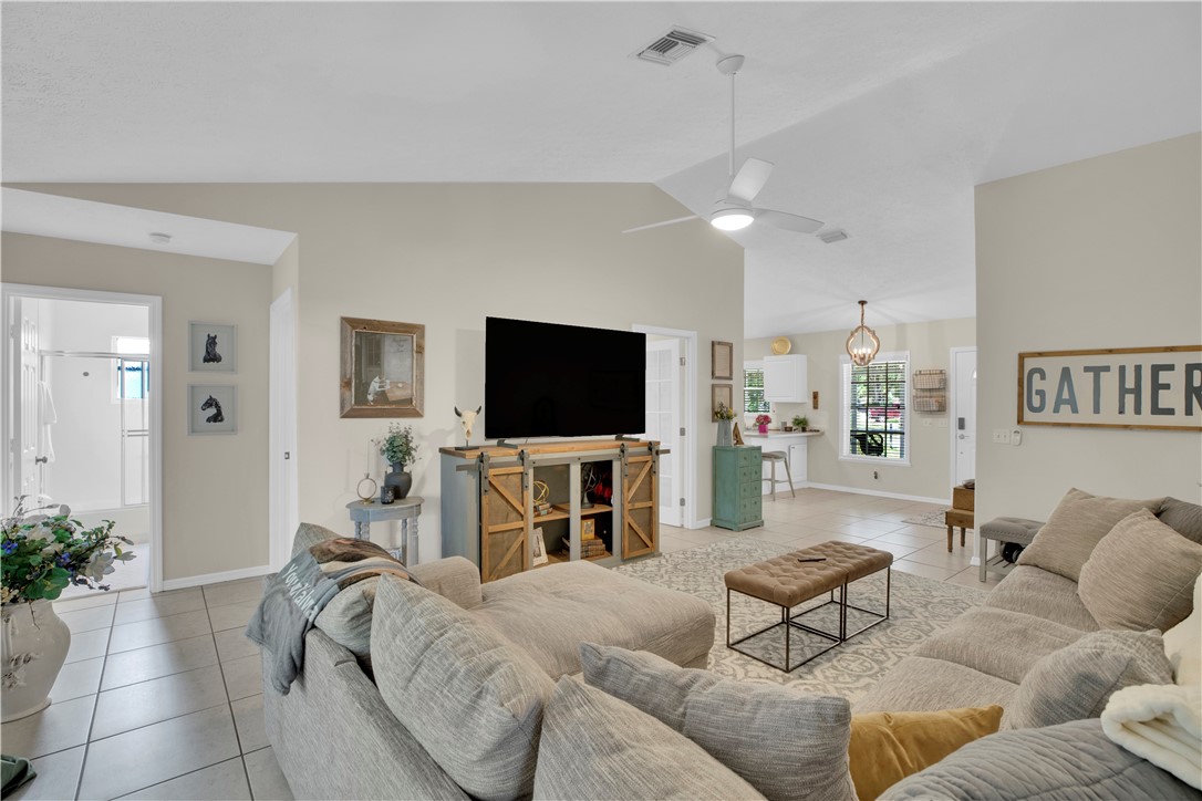726 63rd Avenue Vero Beach, FL 32968 - Photo 12 of 22 a living room with furniture and a flat screen tv