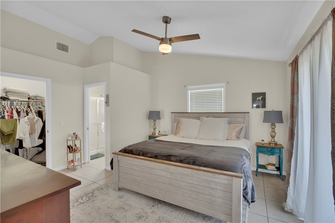 726 63rd Avenue Vero Beach, FL 32968 - Photo 13 of 22 a living room with a bed furniture and a window