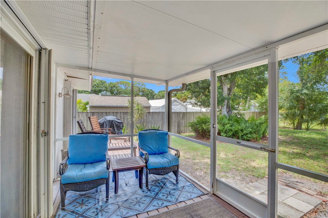 726 63rd Avenue Vero Beach, FL 32968 - Photo 19 of 22 a balcony with chairs and a table