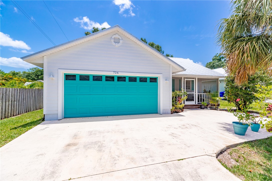 726 63rd Avenue Vero Beach, FL 32968 - Photo 2 of 22 a view of a house with garden and yard