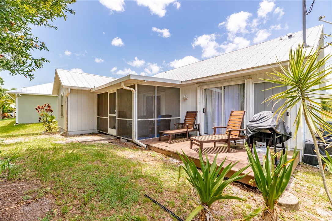 726 63rd Avenue Vero Beach, FL 32968 - Photo 22 of 22 a view of a dinning area with furniture and backyard