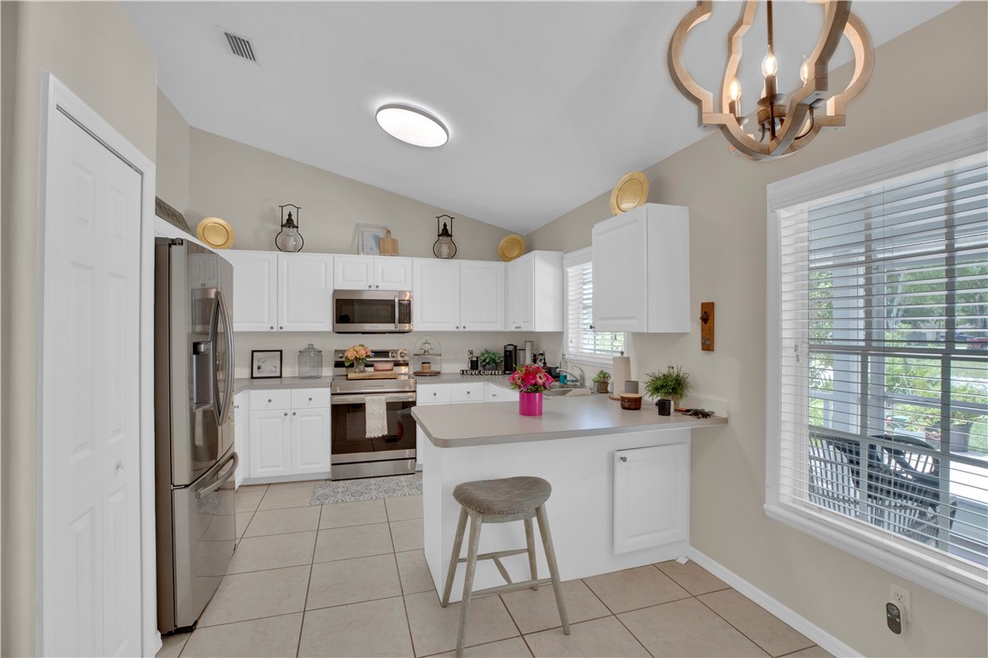 726 63rd Avenue Vero Beach, FL 32968 - Photo 7 of 22 a kitchen with a sink cabinets and window