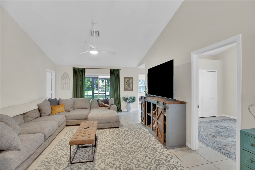 726 63rd Avenue Vero Beach, FL 32968 - Photo 10 of 22 a living room with furniture and a flat screen tv