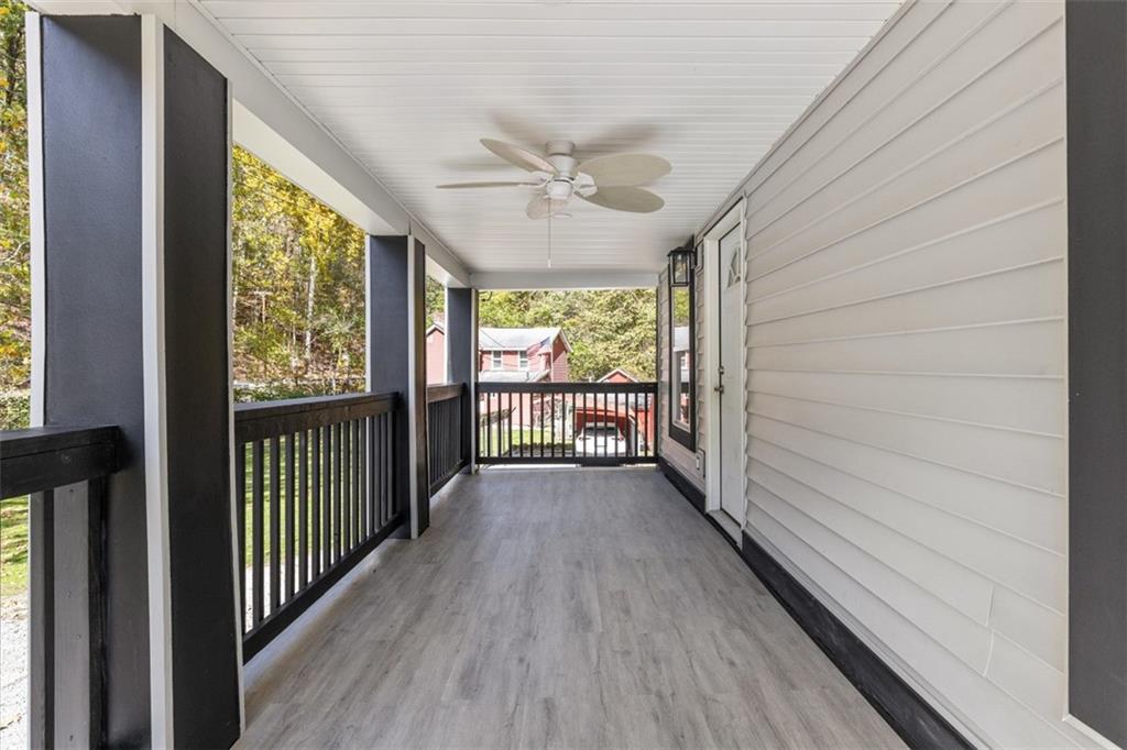 723 Glenfield Road Sewickley, PA 15143 - Photo 12 of 45 a view of a room with wooden floor fan and windows