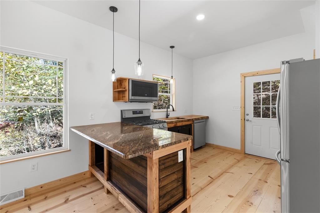 723 Glenfield Road Sewickley, PA 15143 - Photo 14 of 45 a kitchen that has a microwave a sink and a stove in it