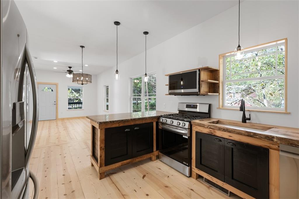723 Glenfield Road Sewickley, PA 15143 - Photo 15 of 45 a kitchen with stainless steel appliances granite countertop a sink stove and refrigerator