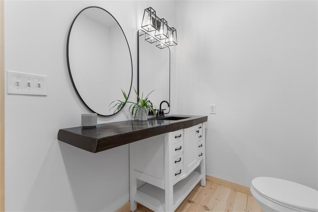 723 Glenfield Road Sewickley, PA 15143 - Photo 26 of 45 a bathroom with a sink a mirror and a toilet