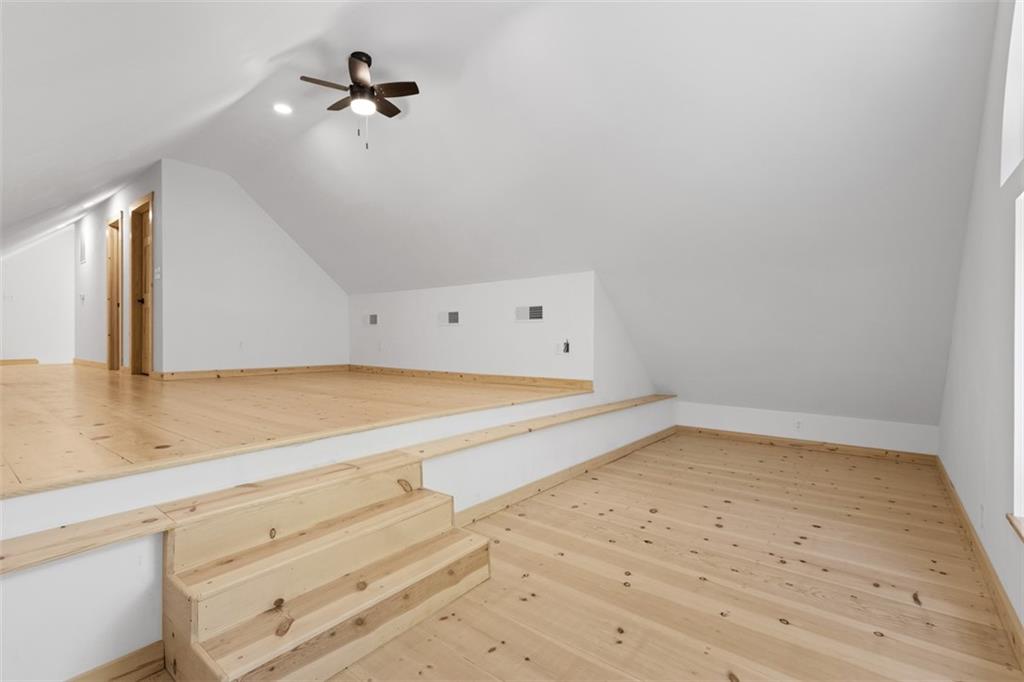 723 Glenfield Road Sewickley, PA 15143 - Photo 39 of 45 a view of a room with wooden floor and fan