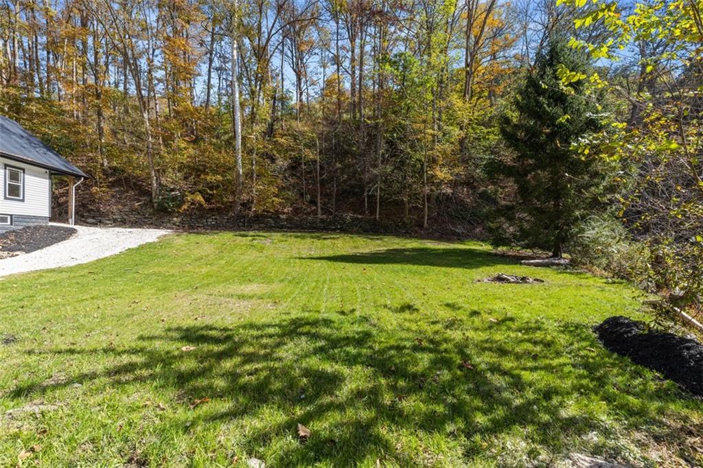 723 Glenfield Road Sewickley, PA 15143 - Photo 5 of 45 a view of a yard with a house in the background