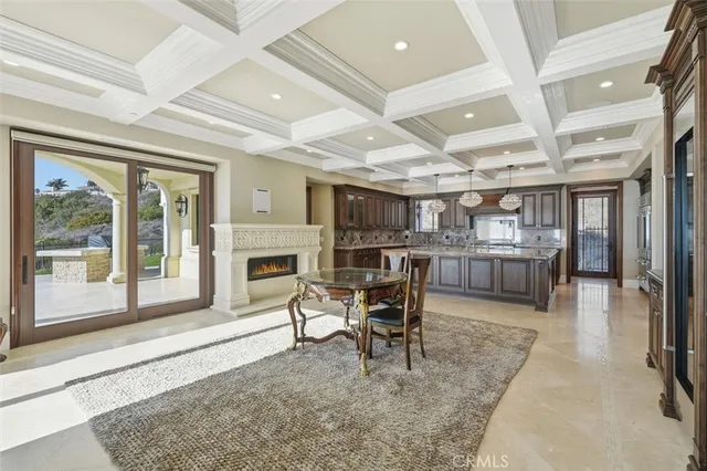 a kitchen with stainless steel appliances granite countertop a sink and a large window