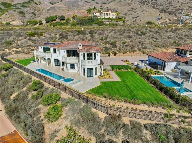 a aerial view of a house with a big yard