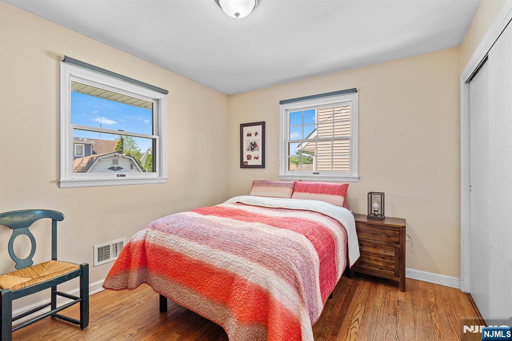 71 Wingra Avenue Rutherford, NJ 07070 - Photo 12 of 20 a bedroom with a bed and wooden floor