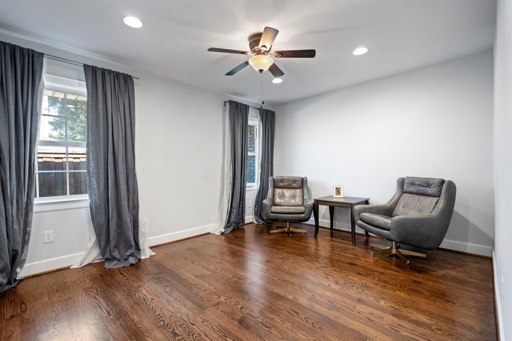 6446 Runnemede Lane Dallas, TX 75214 - Photo 16 of 23 a living room with furniture and a window