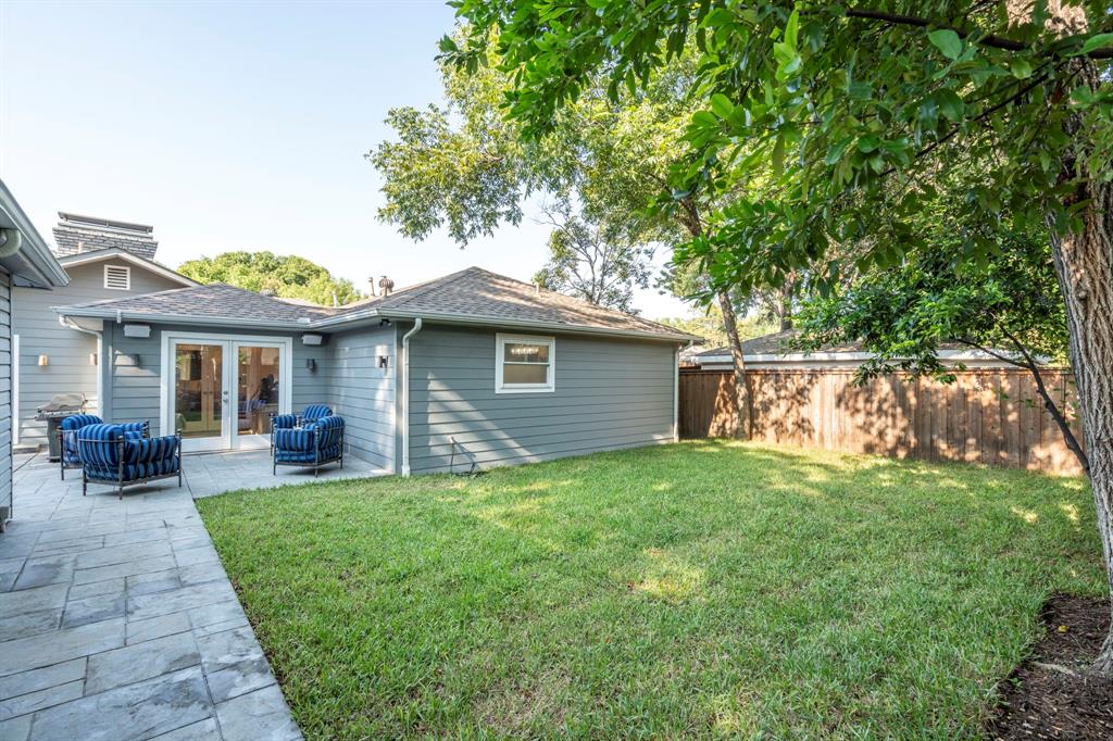 6446 Runnemede Lane Dallas, TX 75214 - Photo 20 of 23 a view of a house with a yard potted plants and a large tree