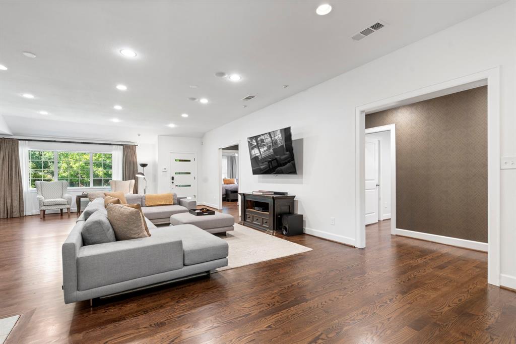 6446 Runnemede Lane Dallas, TX 75214 - Photo 5 of 23 a living room with fireplace furniture and a flat screen tv