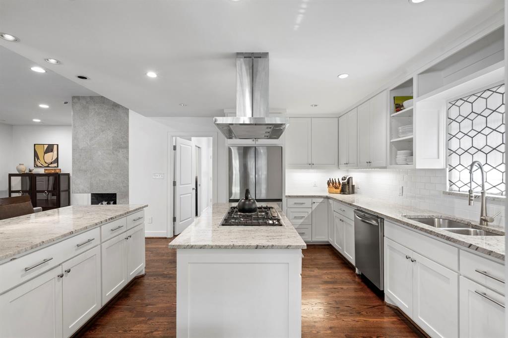 6446 Runnemede Lane Dallas, TX 75214 - Photo 7 of 23 a kitchen with stainless steel appliances granite countertop a sink stove and refrigerator
