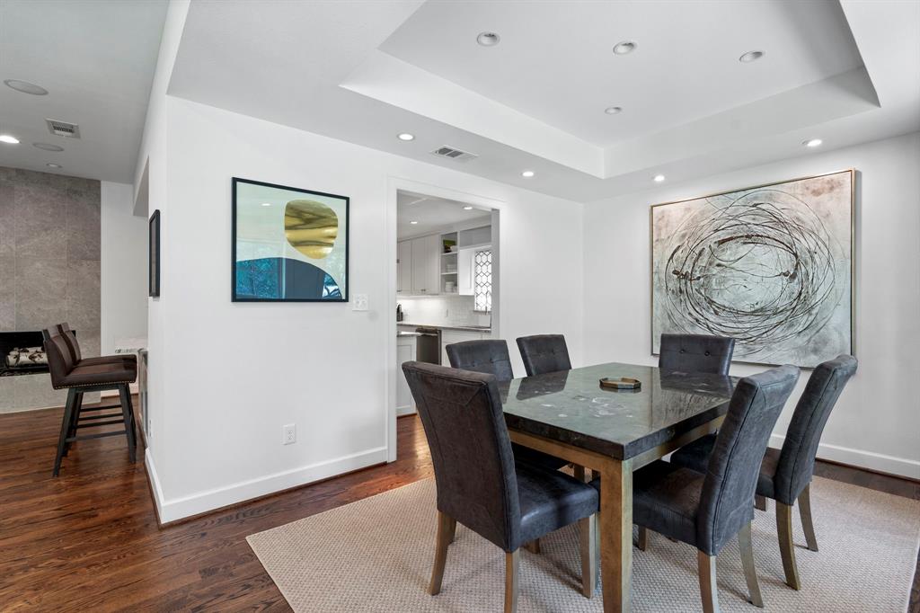 6446 Runnemede Lane Dallas, TX 75214 - Photo 8 of 23 a view of a dining room with furniture and wooden floor