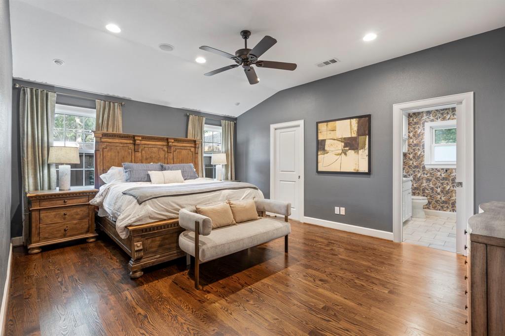 6446 Runnemede Lane Dallas, TX 75214 - Photo 9 of 23 a bedroom with a bed and wooden floor