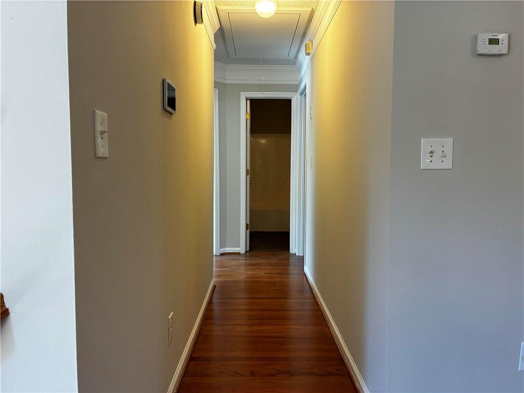 337 Madison Avenue Hampton, GA 30228 - Photo 13 of 32 a view of a hallway with wooden floor