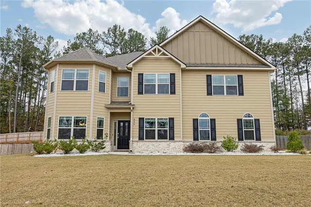 front view of a house and a yard