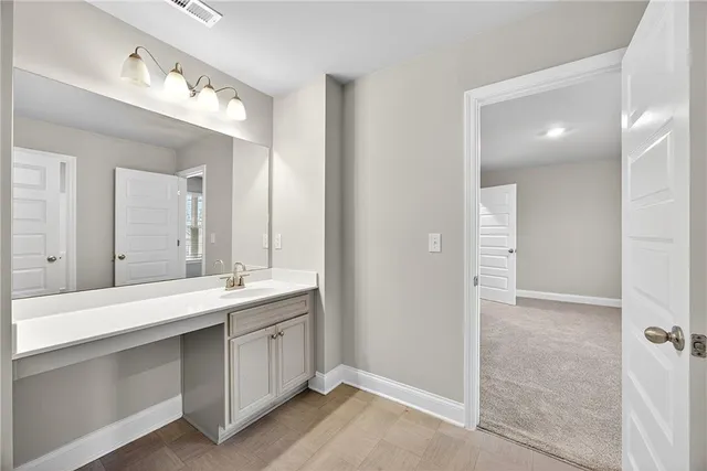 a bathroom with a double vanity sink mirror and