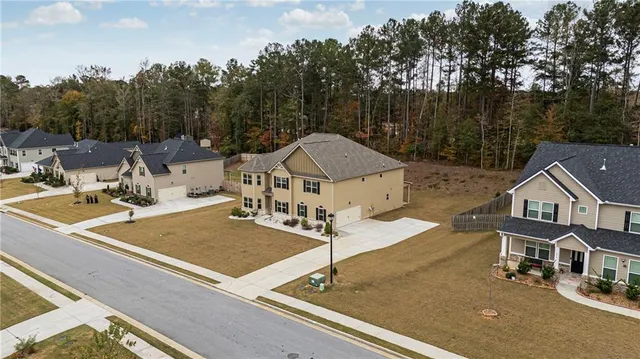 a view of a house with large trees
