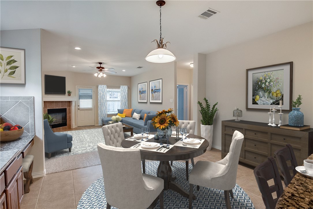 a dining room with furniture a chandelier and window