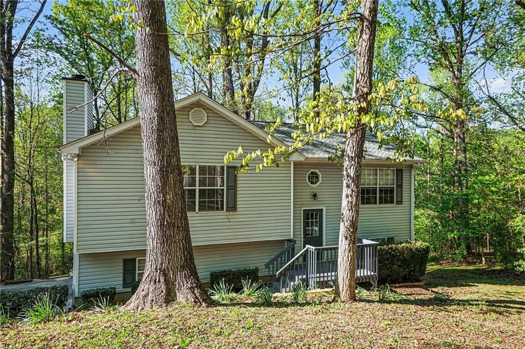 4083 Country Lane Gainesville, GA 30507 - Photo 1 of 18 a front view of a house with garden