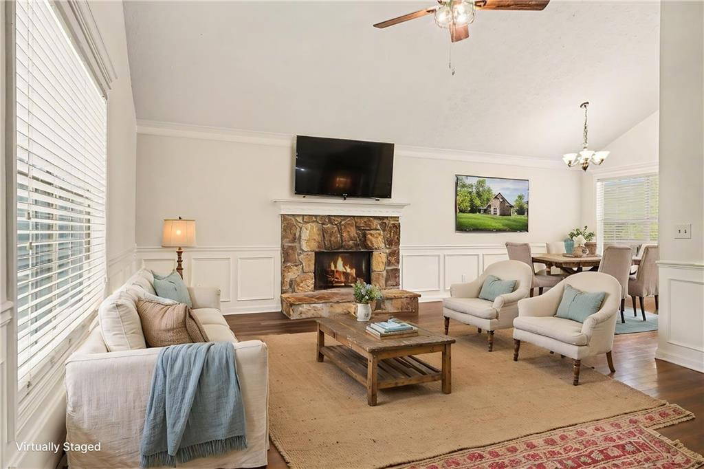 4083 Country Lane Gainesville, GA 30507 - Photo 2 of 18 a living room with furniture fireplace and a flat screen tv