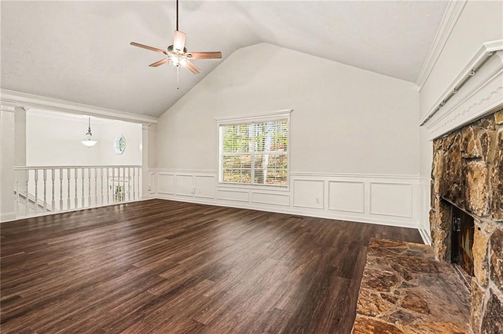 4083 Country Lane Gainesville, GA 30507 - Photo 7 of 18 a view of an empty room with wooden floor and a window