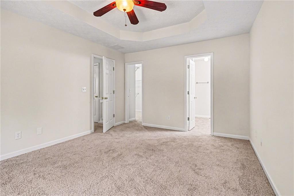 4083 Country Lane Gainesville, GA 30507 - Photo 8 of 18 an empty room with chandelier fan