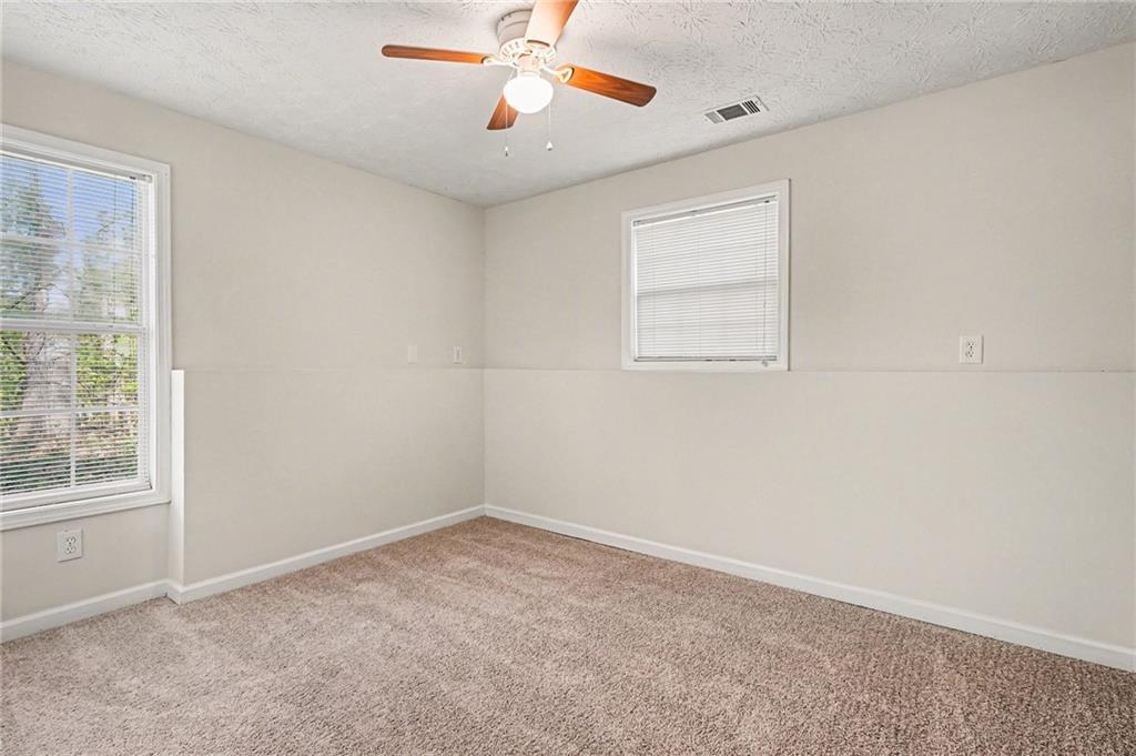 4083 Country Lane Gainesville, GA 30507 - Photo 10 of 18 an empty room with a window and a fan