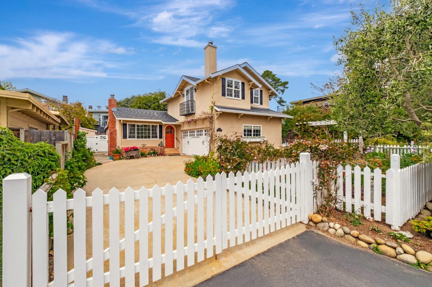 a front view of a house with wooden fence