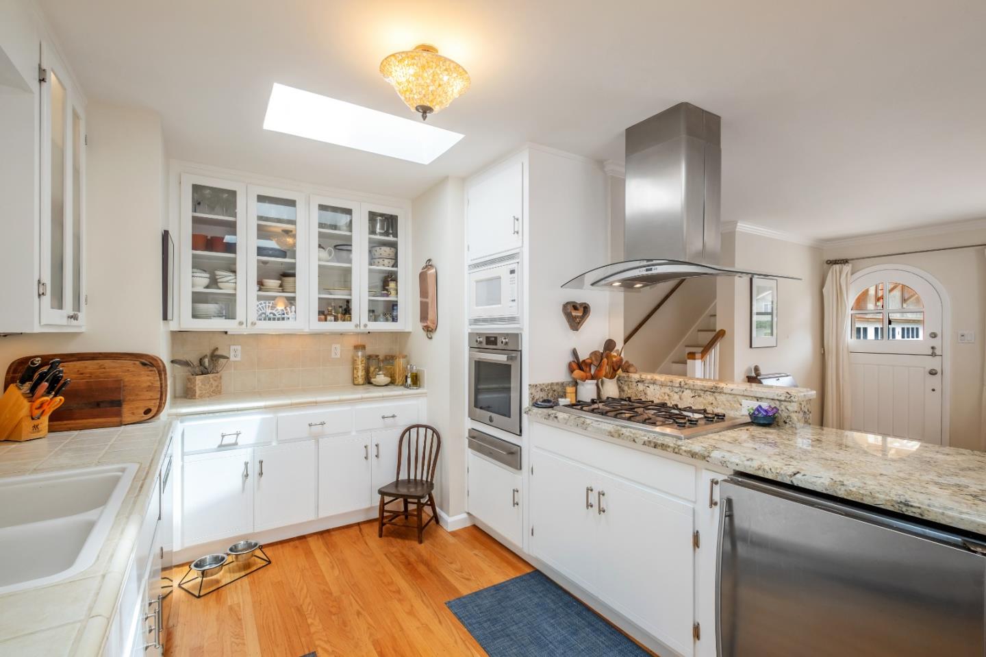111 Farley Drive Aptos, CA 95003 - Photo 8 of 22 a kitchen with a sink stove and cabinets