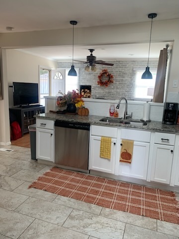 315 Sheridan Street Park Forest, IL 60466 - Photo 14 of 32 a kitchen with a sink a stove a microwave and cabinets