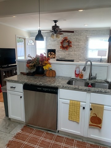 315 Sheridan Street Park Forest, IL 60466 - Photo 18 of 32 a kitchen with stainless steel appliances granite countertop a sink and a stove
