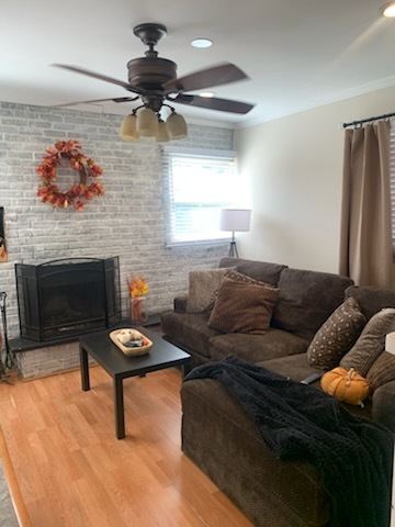 315 Sheridan Street Park Forest, IL 60466 - Photo 20 of 32 a living room with furniture and a fireplace