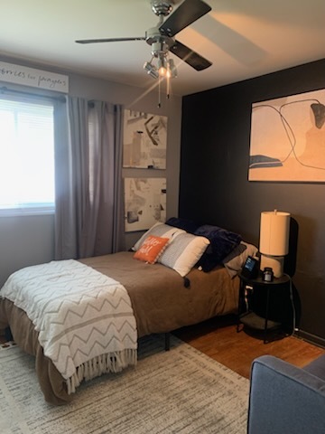 315 Sheridan Street Park Forest, IL 60466 - Photo 30 of 32 a bedroom with a bed and a chandelier