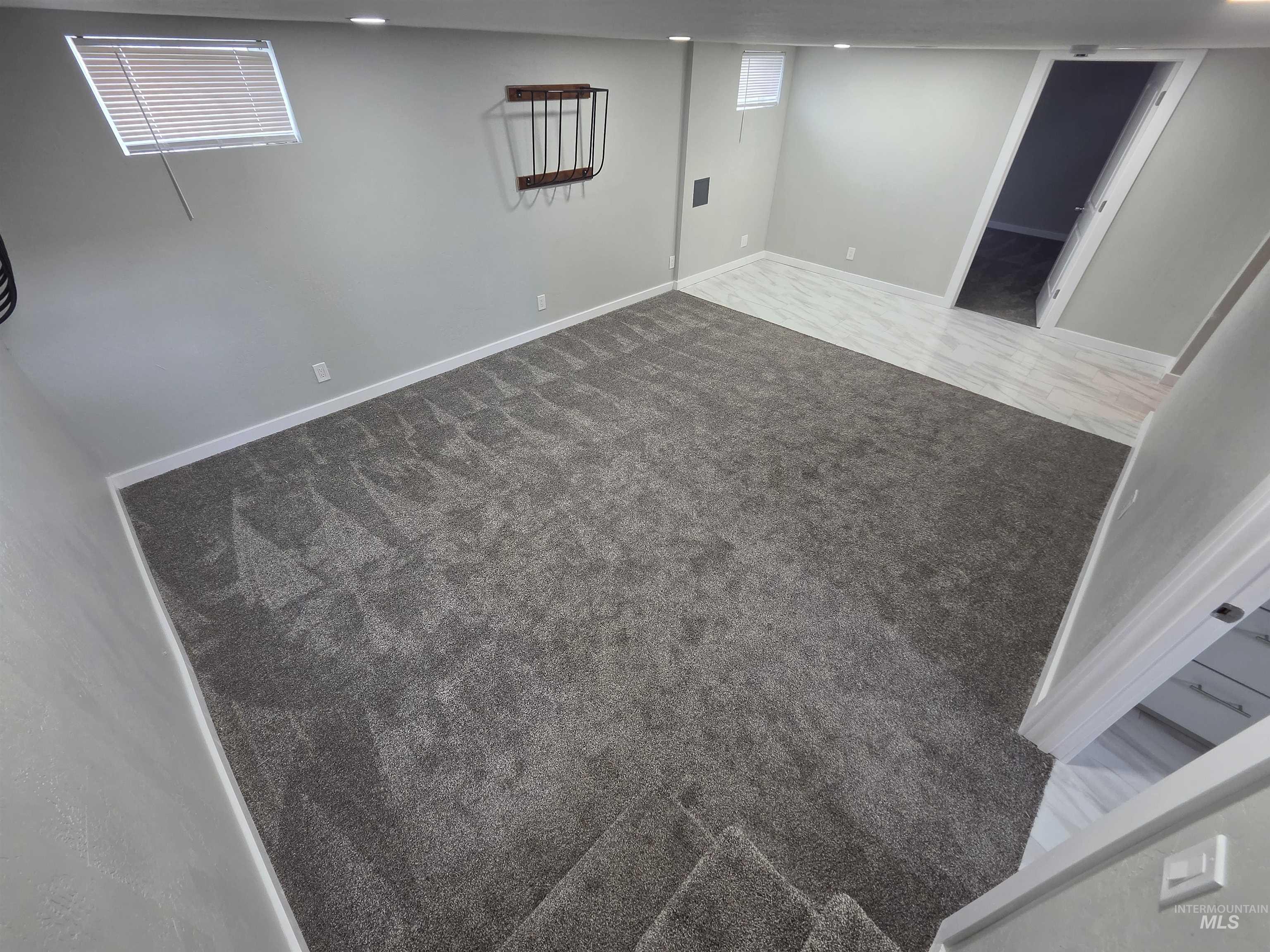 905 15th Drive Rupert, ID 83350 - Photo 11 of 20 Spacious room featuring gray wall-to-wall carpeting, recessed lighting, and light gray wall paint