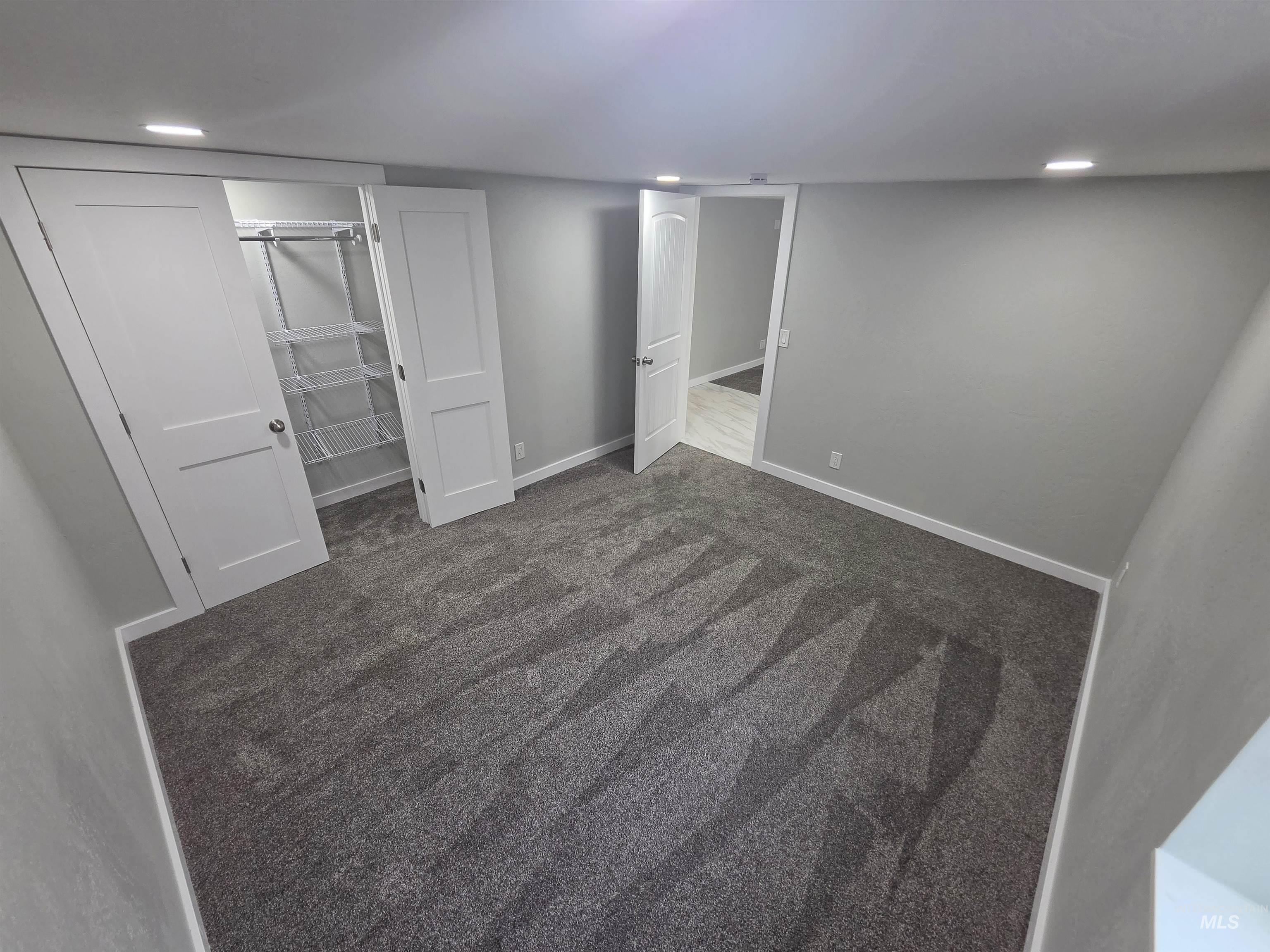 905 15th Drive Rupert, ID 83350 - Photo 15 of 20 Spacious interior room featuring plush patterned carpeting, recessed ceiling lighting, a closet with wire shelving, and crisp white trim