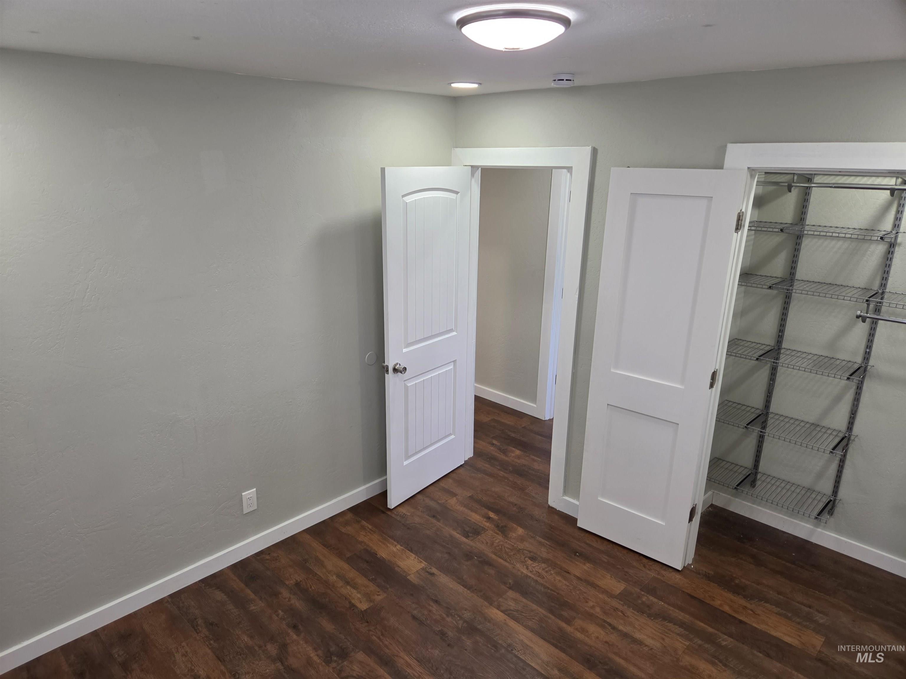 905 15th Drive Rupert, ID 83350 - Photo 5 of 20 Room featuring wood-finish flooring, light grey walls, and white trim