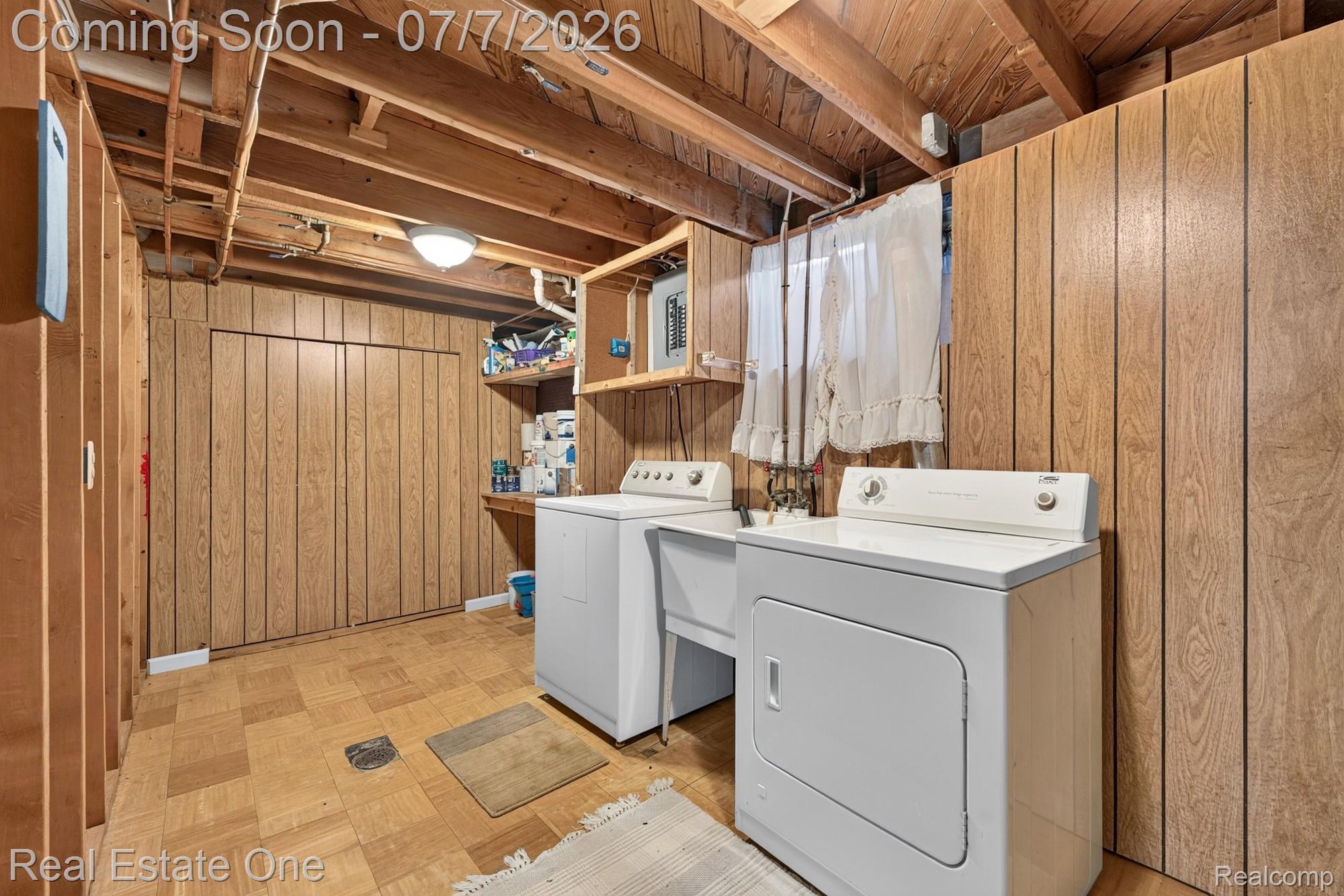 24749 Munson Street Taylor, MI 48180 - Photo 23 of 28 Utility area featuring exposed wood beams, wood-paneled walls, and square vinyl tile flooring